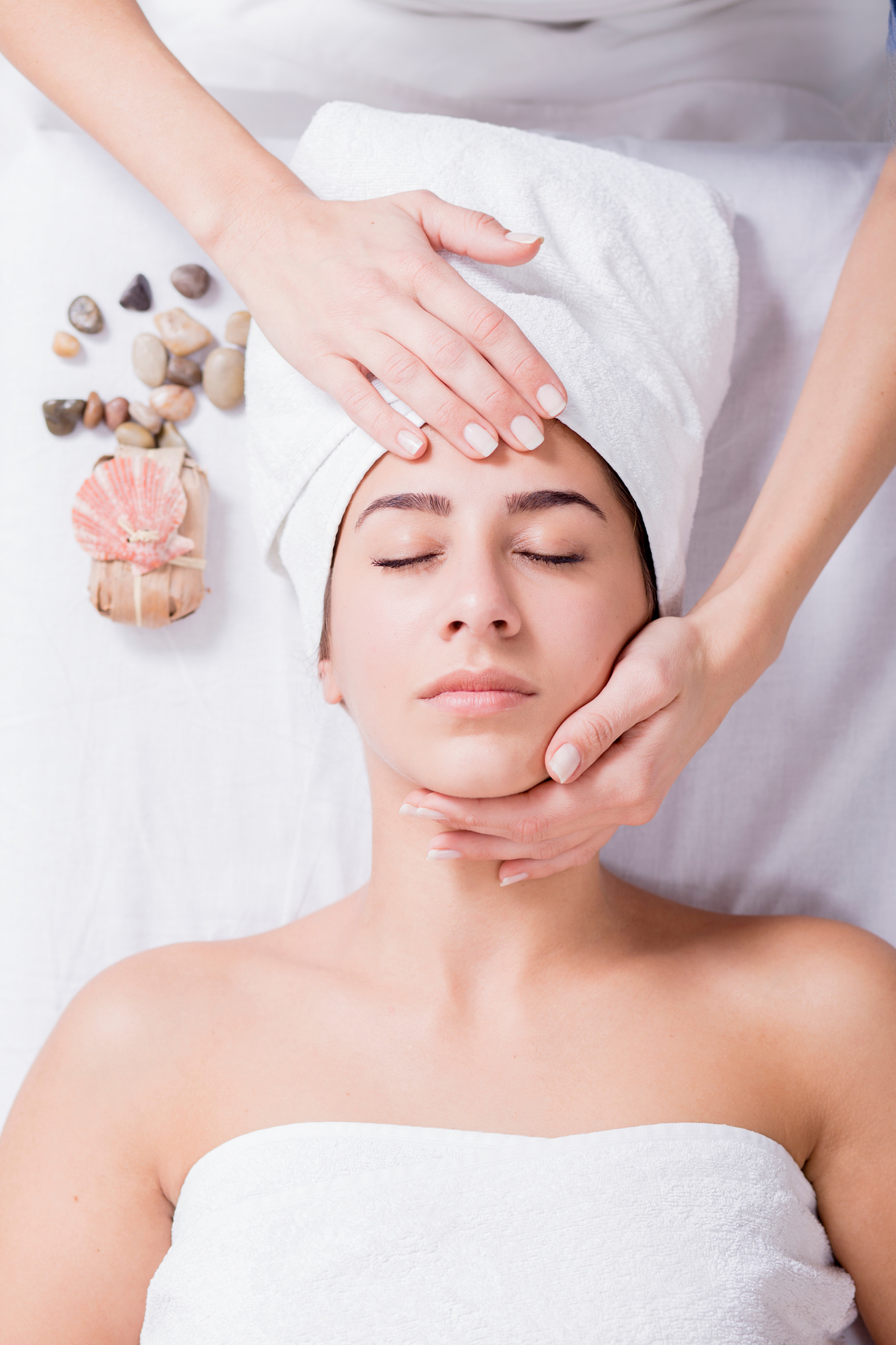 Young woman enjoying facial massage